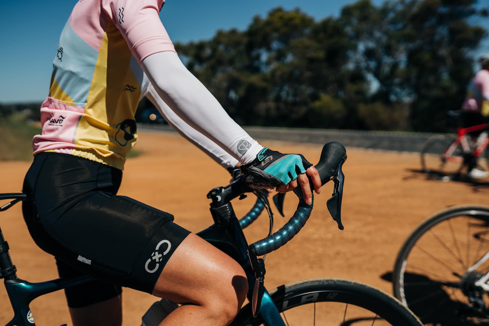 Image of cyclist wearing SParms sun sleeves.