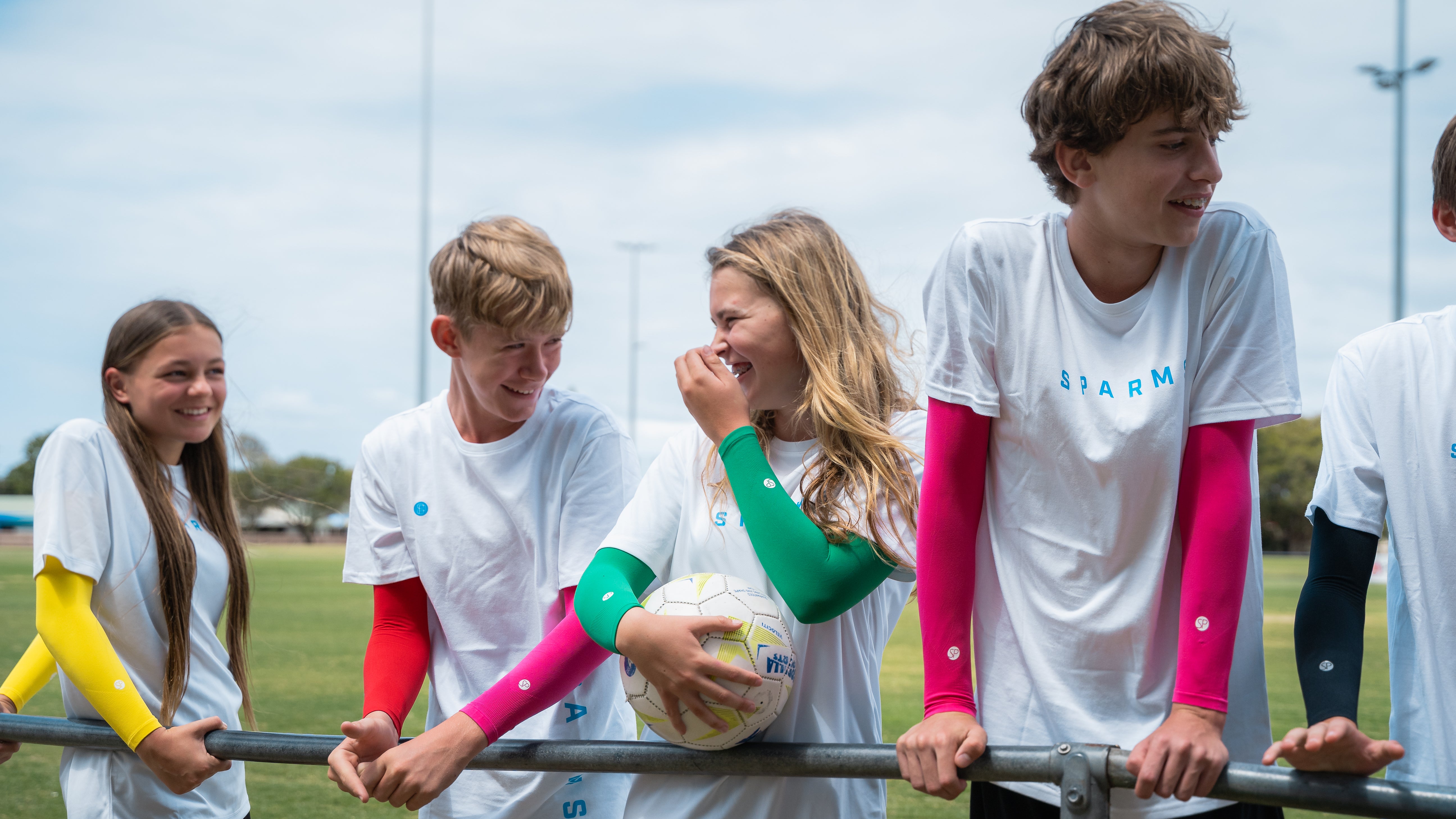 Image of soccer players wearing SParms every day sleeves for kids.