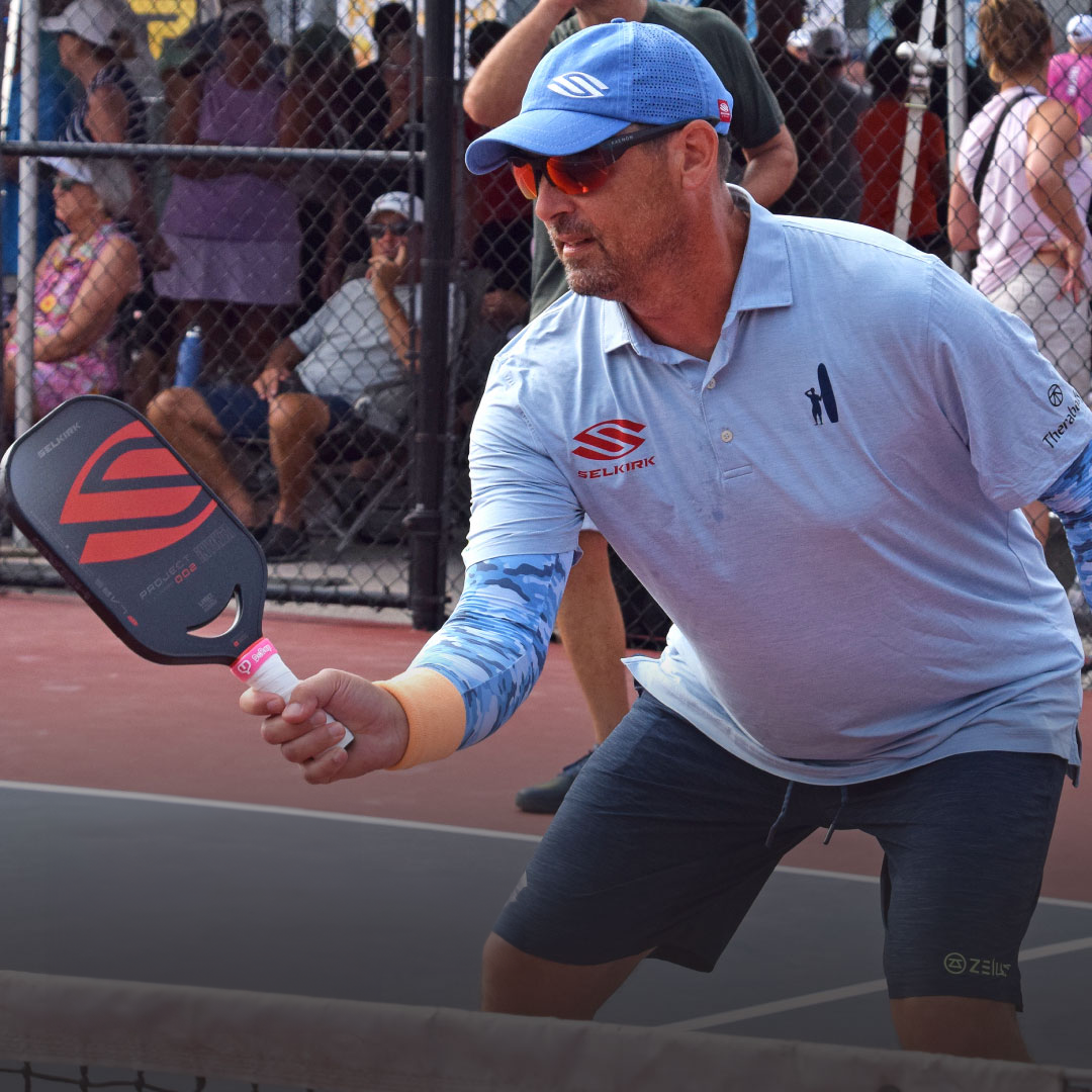 Image of a pickleball pro wearing camo SParms sun sleeves.